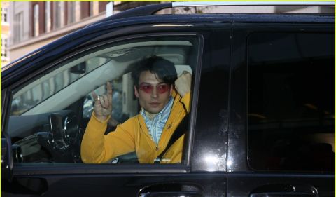 Ezra Miller posed inside of his car what going out.